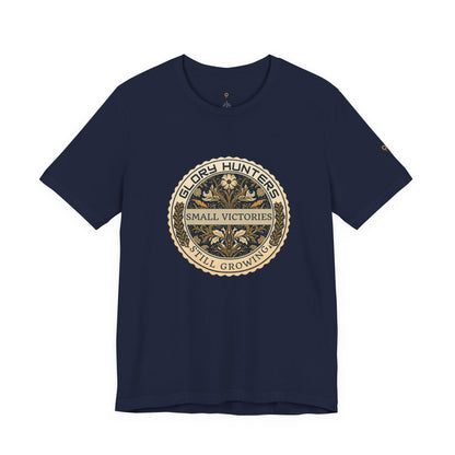 T‑Shirt — Vintage 'Glory Hunters: Small Victories Still Growing' Emblem